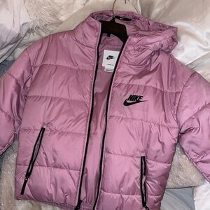 pink nike puffer jacket.